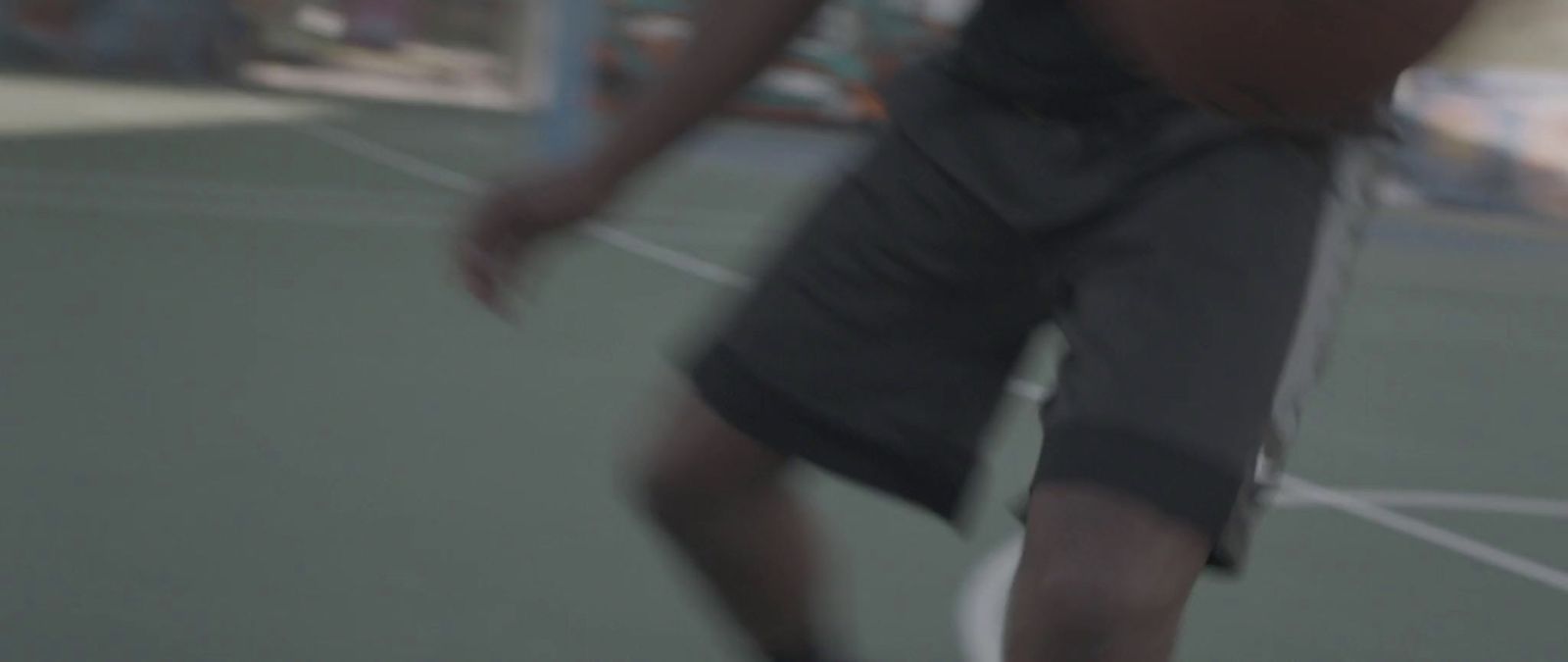 a man holding a tennis racquet on top of a tennis court