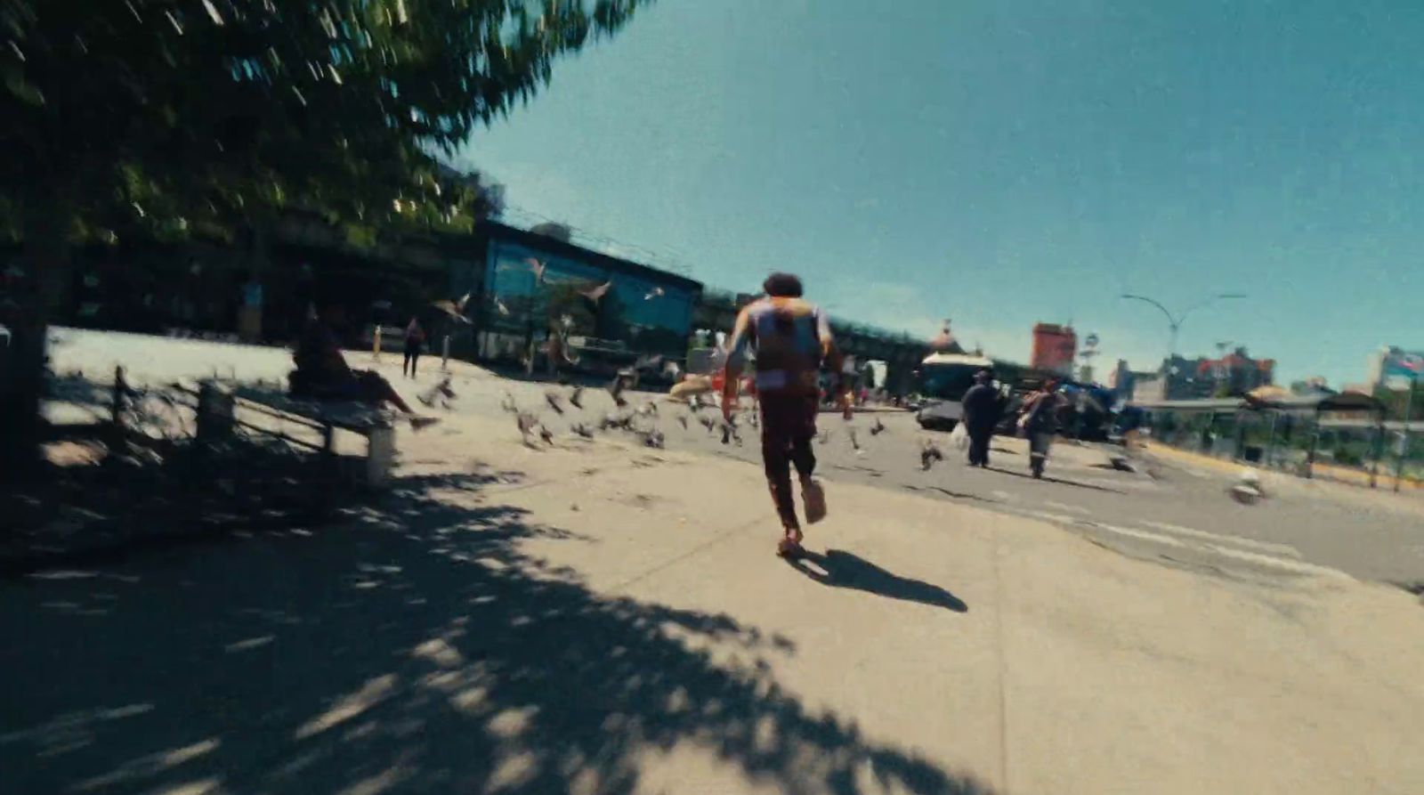 a man riding a skateboard down a street