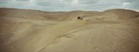 a couple of people riding on the back of a dirt bike