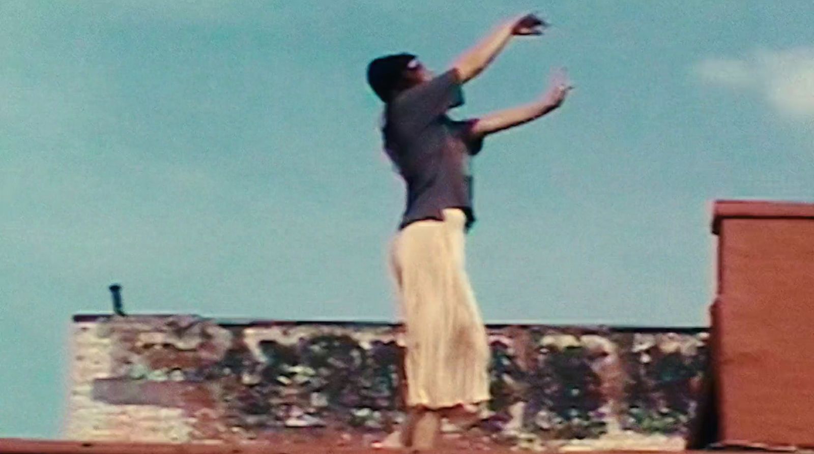 a person jumping in the air with a frisbee