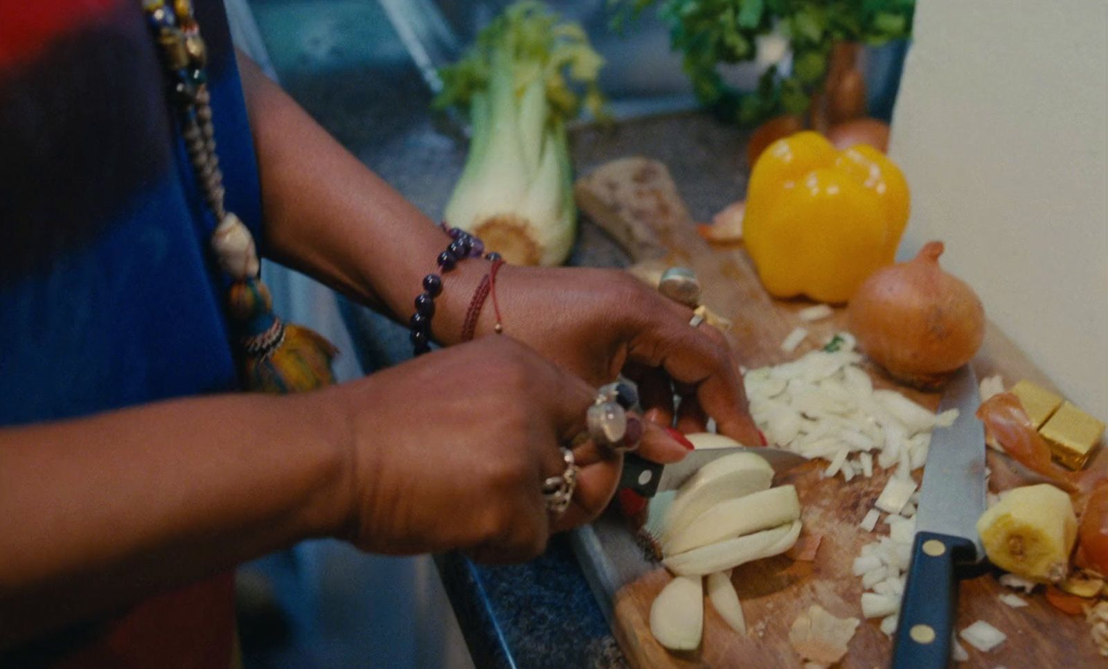 a person chopping onions on a cutting board