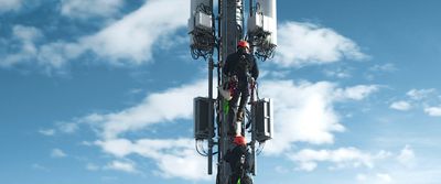 a cell phone tower with a sky background