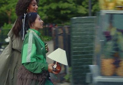 a couple of women walking down a street