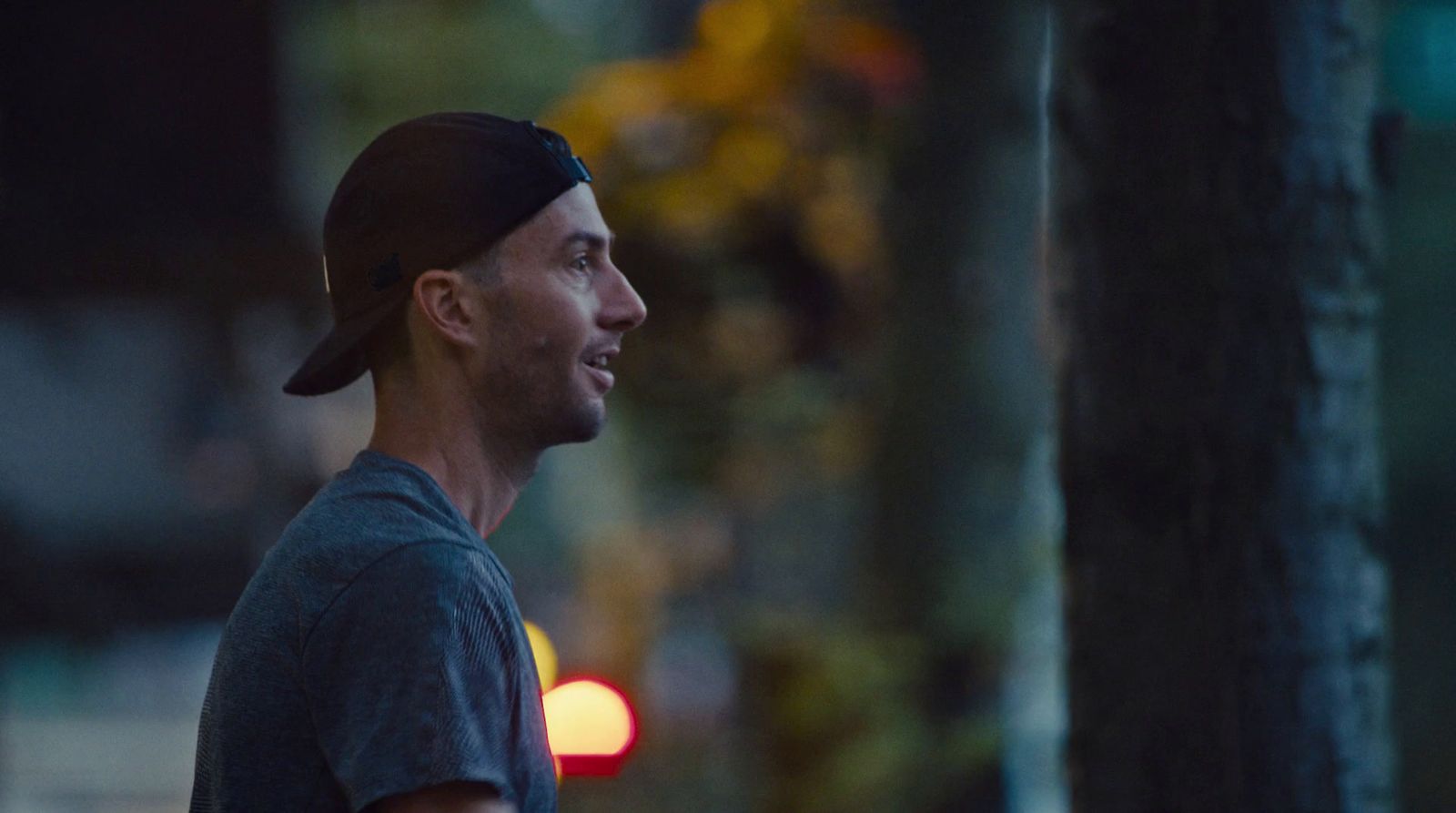 a man standing in the street at night