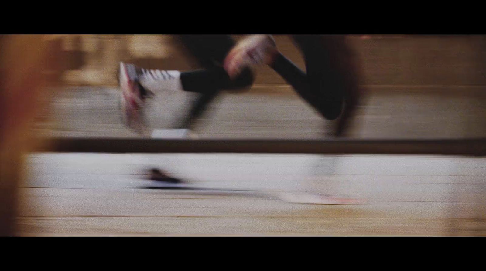 a blurry photo of a person jumping on a skateboard