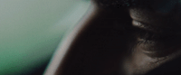 a close up of a person's eye with a blurry background