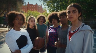 a group of young women standing next to each other