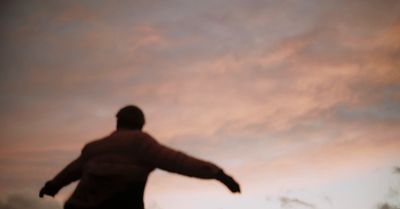 a man is flying a kite in the sky