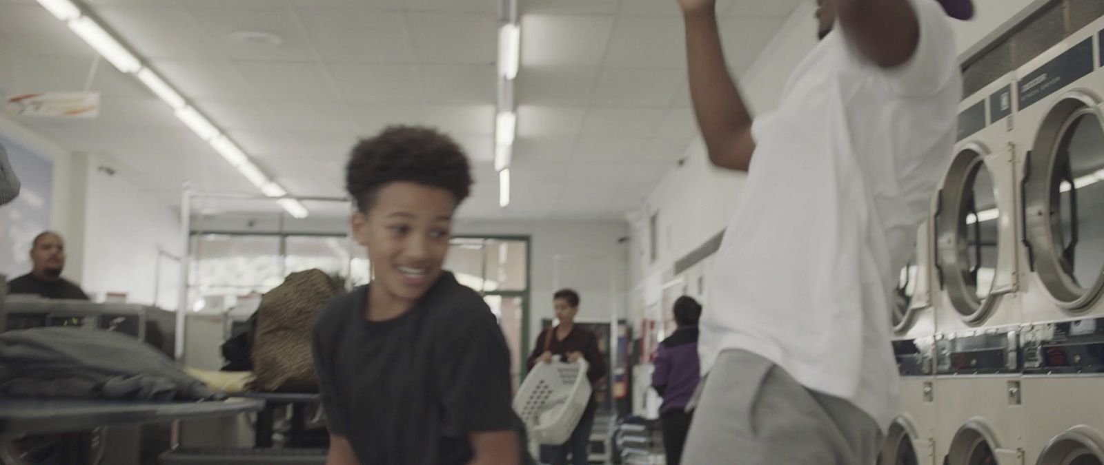 a man and a boy playing a video game