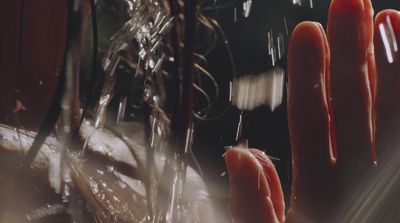 a close up of a person's hands with water on them