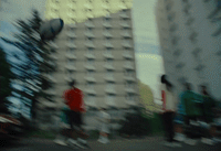 a blurry photo of a group of skateboarders