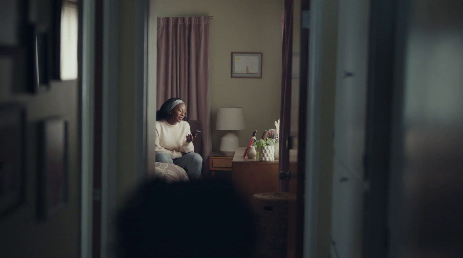 a woman sitting on a chair in a room