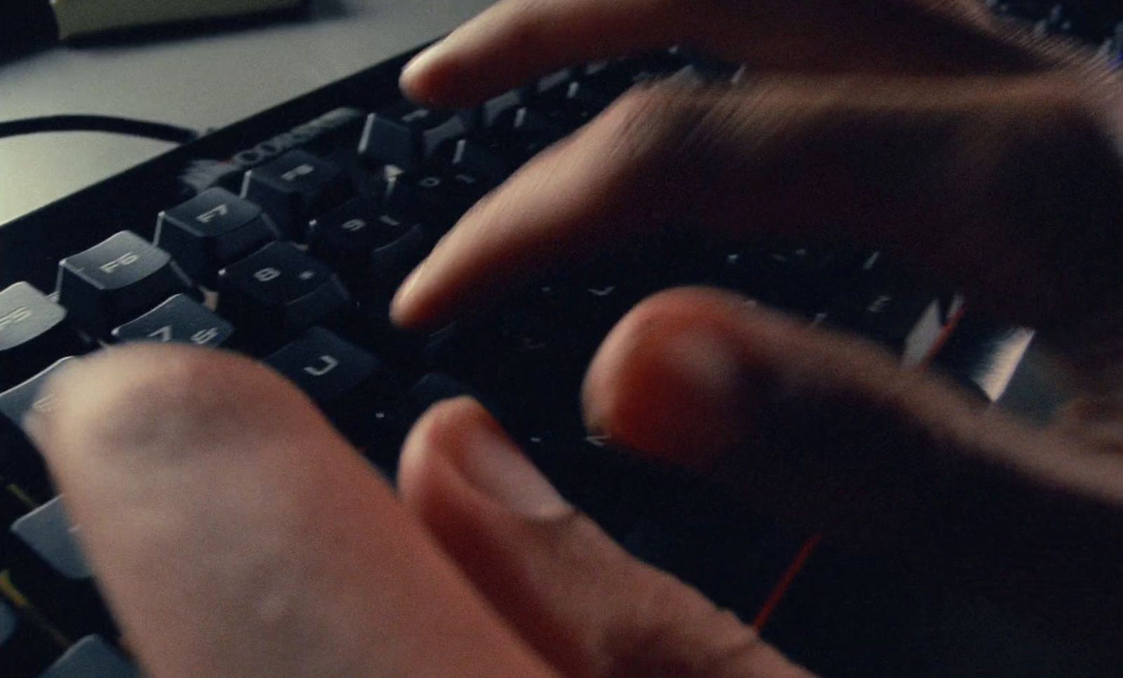 a close up of a person typing on a keyboard