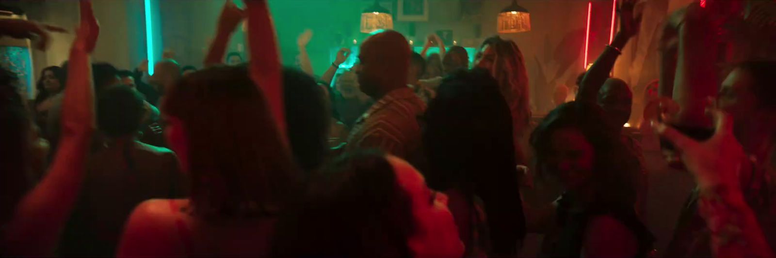 a group of people dancing at a party