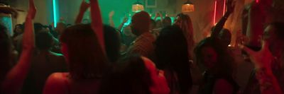 a group of people dancing at a party