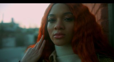 a close up of a person with red hair