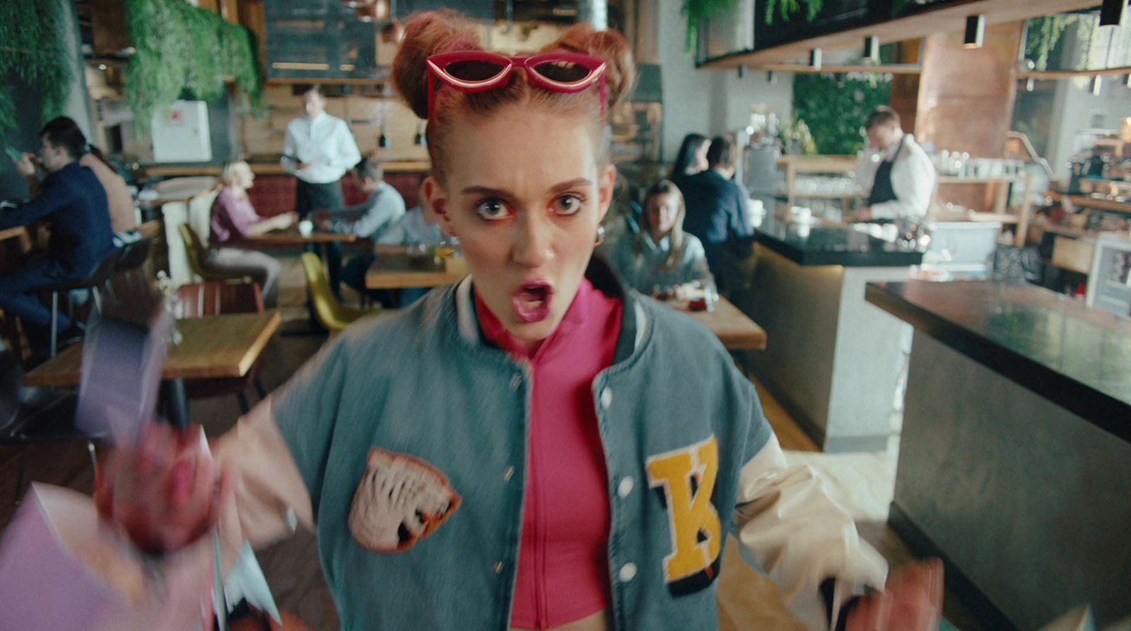 a woman in a restaurant with a surprised look on her face