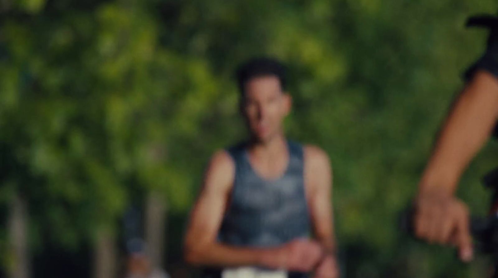 a blurry photo of a man holding a frisbee