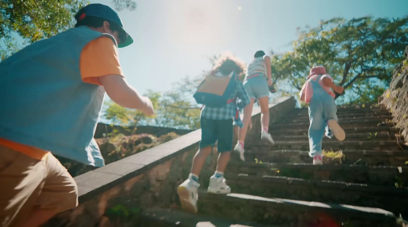 a group of people walking up a flight of stairs