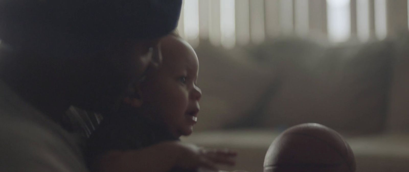 a woman holding a baby in her arms