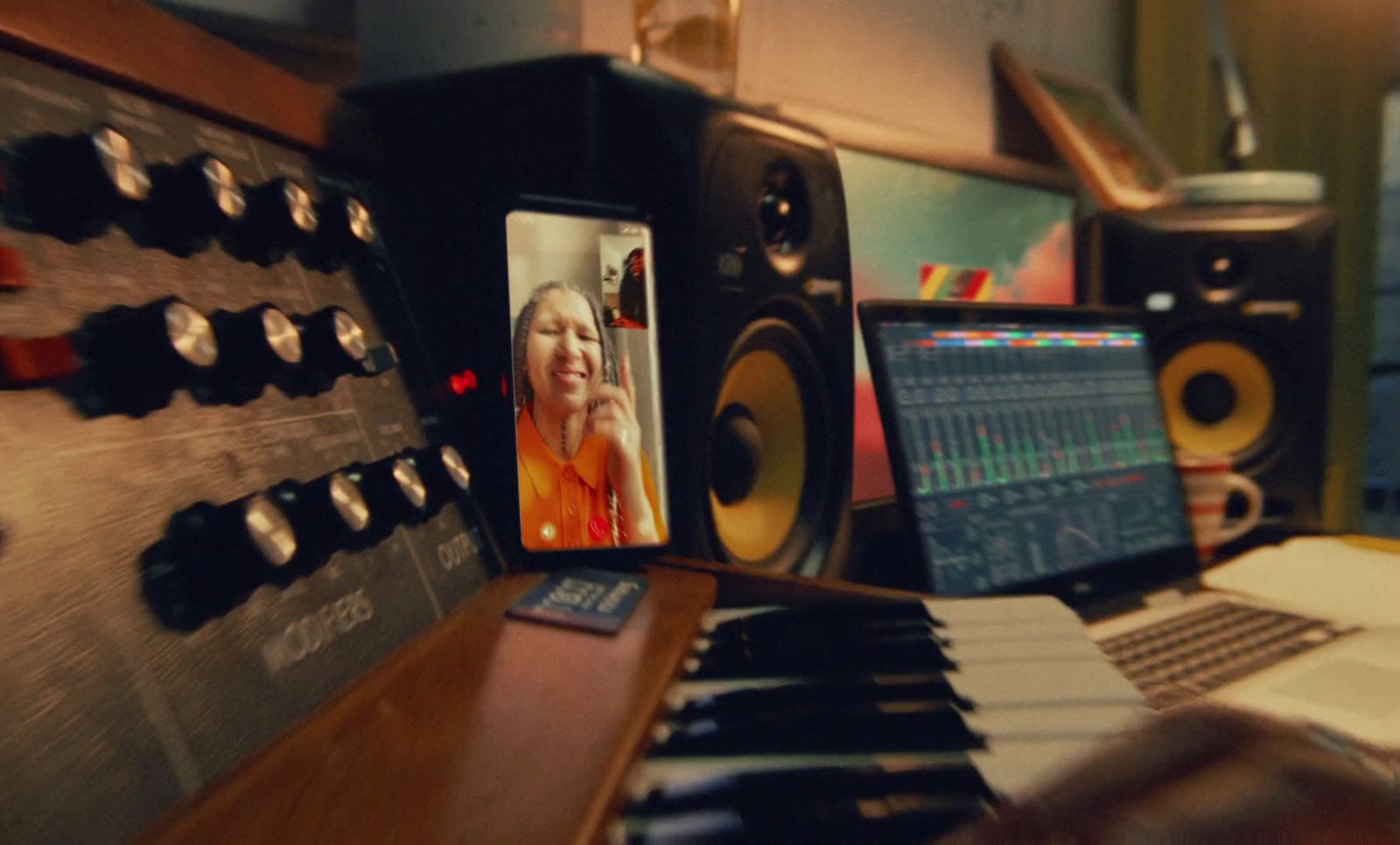 a picture of a woman on a computer screen next to a keyboard