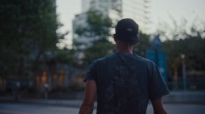 a man riding a skateboard down a street