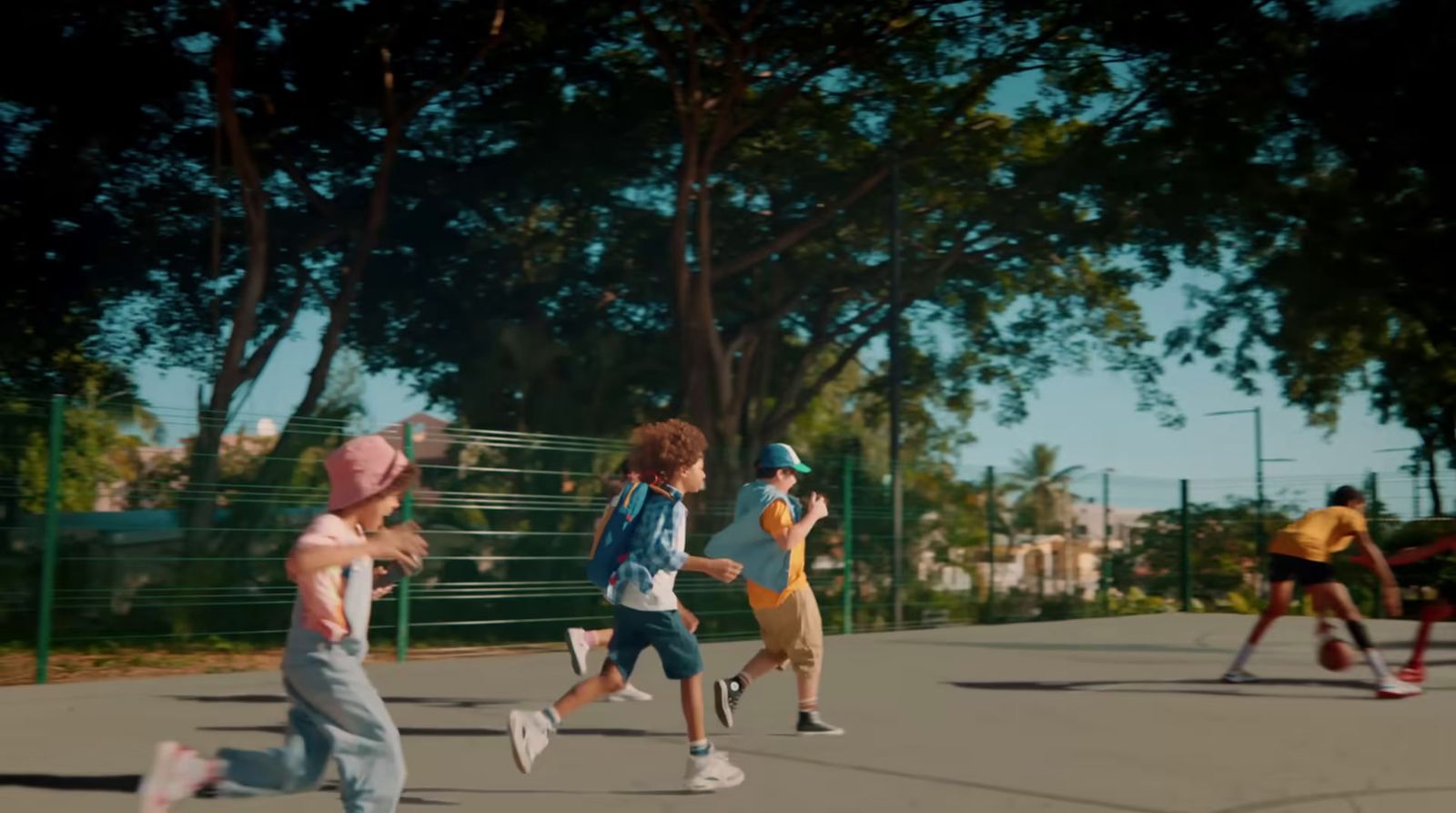 a group of young children playing a game of frisbee