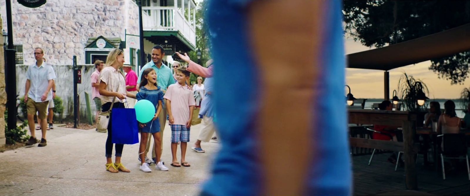 a group of people standing around each other