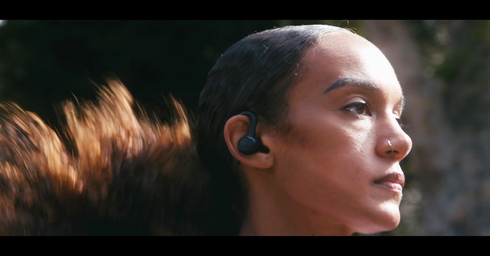 a woman with ear buds on her ears