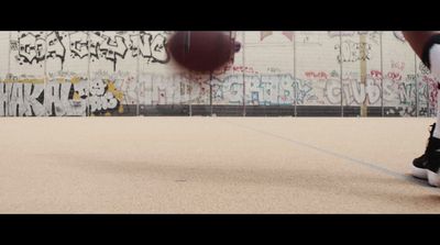 a person with a basketball on a court