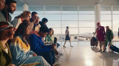 a group of people waiting in an airport