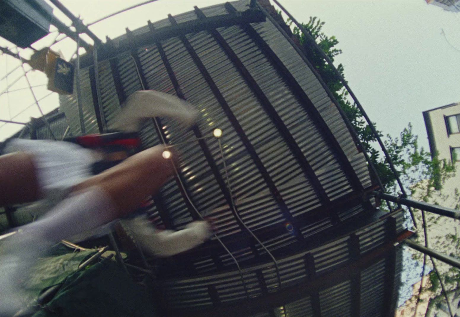 a man riding a skateboard down a metal handrail