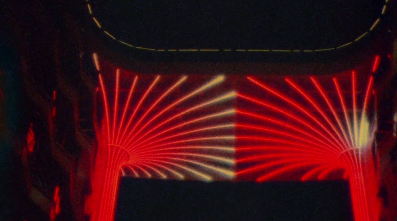 a red and white photo of a street light