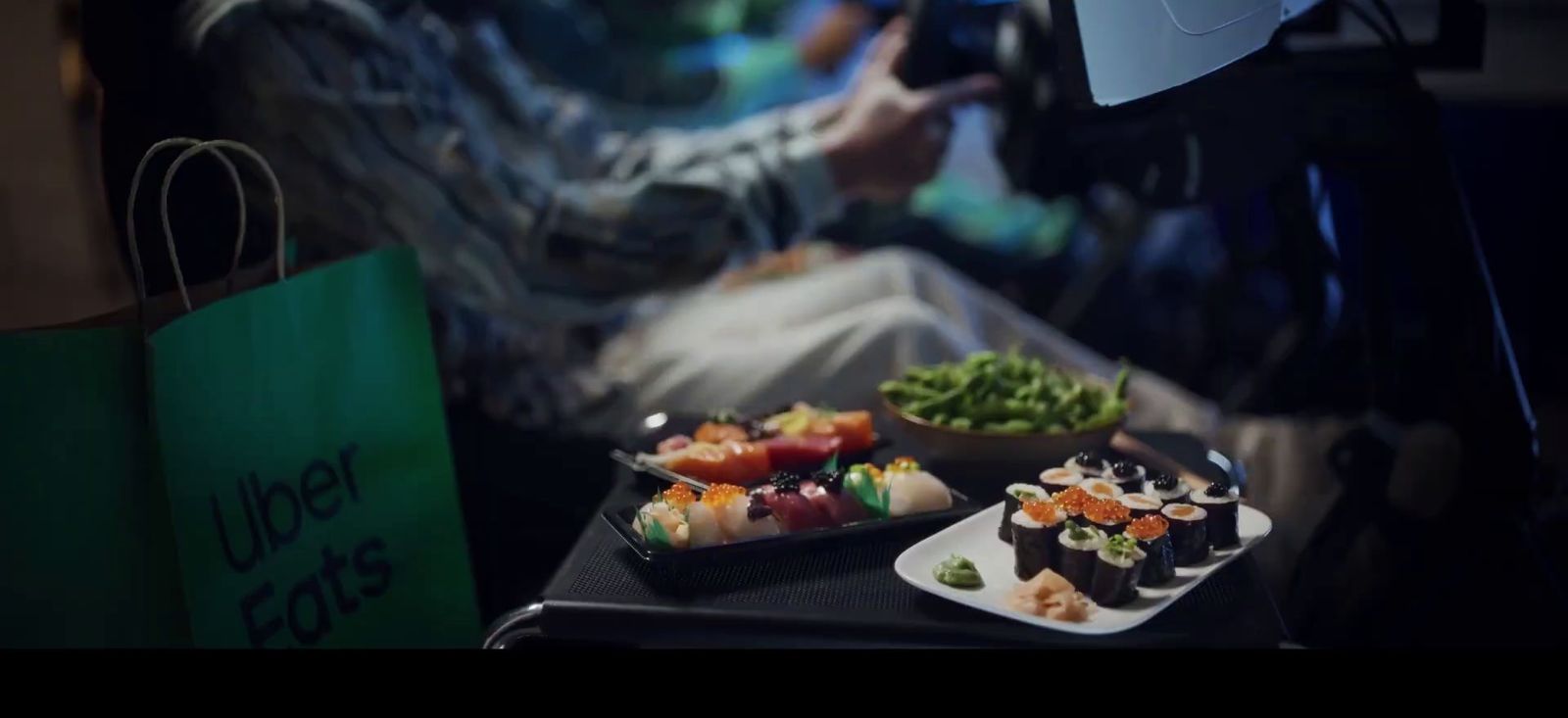 a man sitting at a table with a plate of food