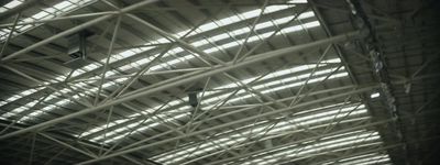 the ceiling of a train station with many windows