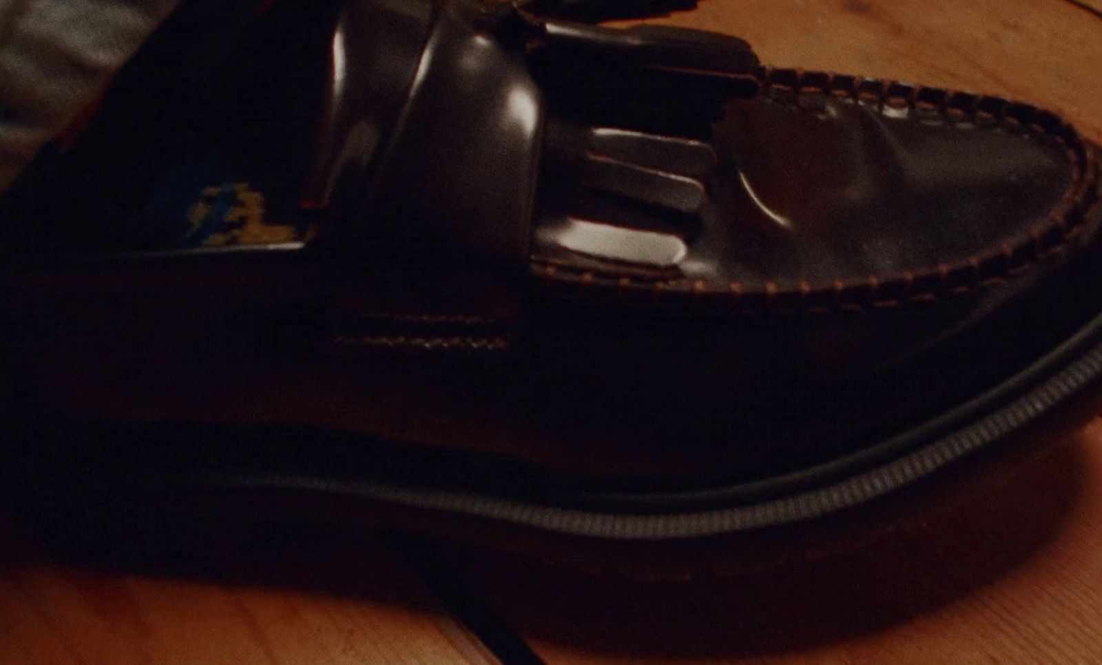 a pair of shoes sitting on top of a wooden table