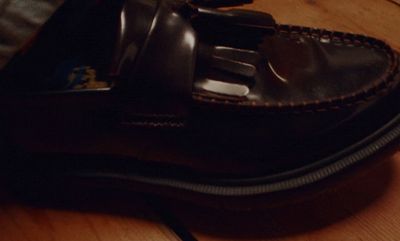 a pair of shoes sitting on top of a wooden table