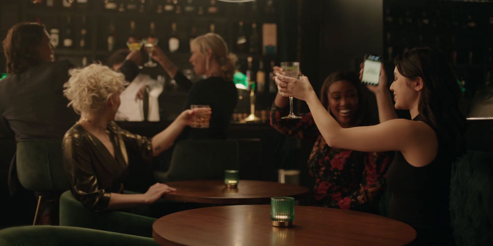 a group of women sitting at a table with drinks