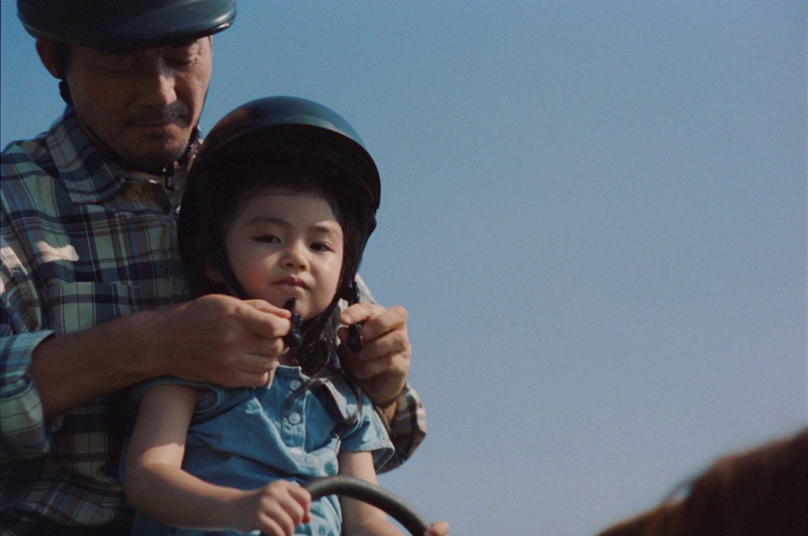 a man is holding a child on a horse