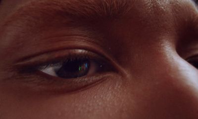 a close up of a person's eye with a blurry background