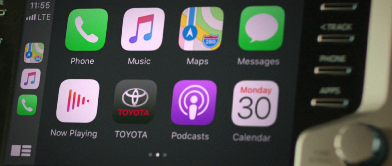 a close up of a car dashboard with various app icons