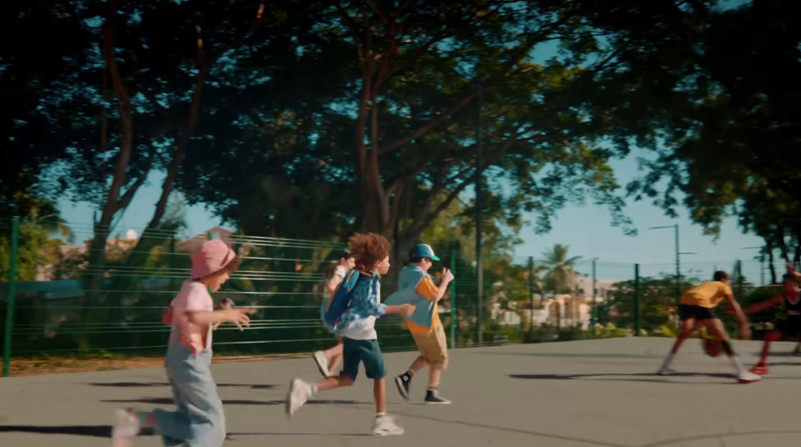 a group of people running down a street