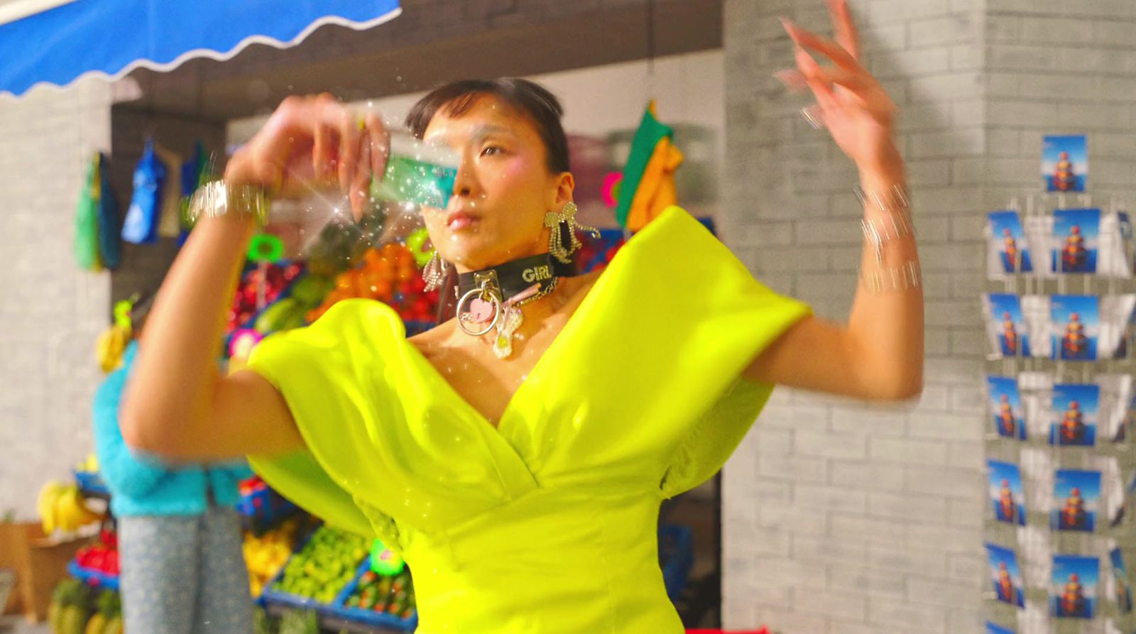 a woman in a yellow dress standing in front of a store