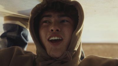 a man in a hoodie making a funny face