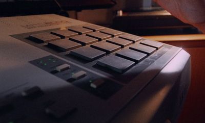 a close up of a person pressing buttons on a machine