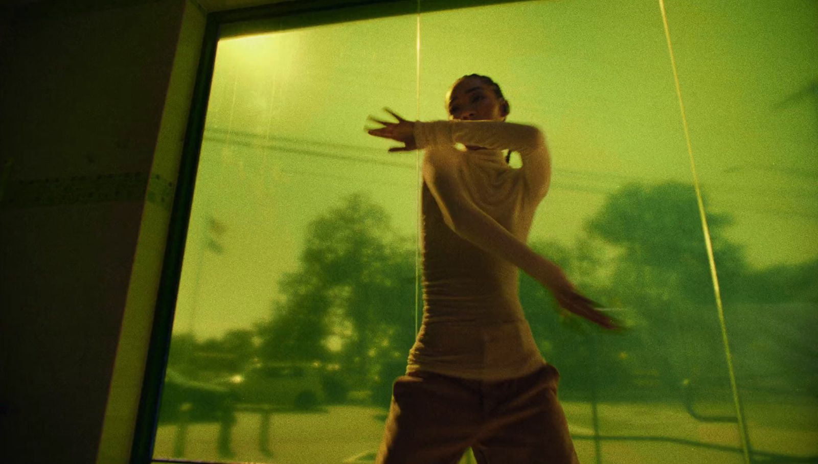 a man standing in front of a glass wall