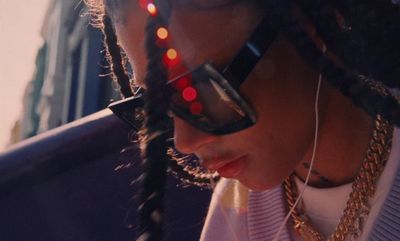 a close up of a person wearing sunglasses