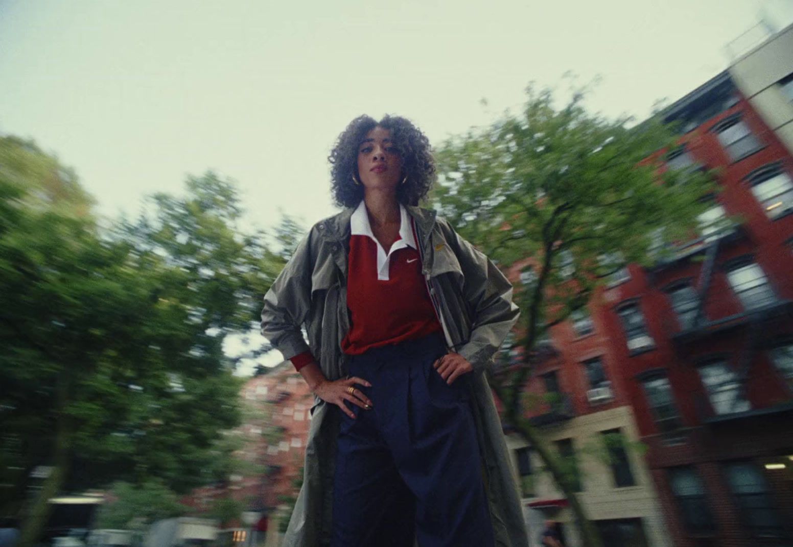 a woman riding a skateboard down a street