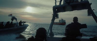 a group of people riding on the back of a boat