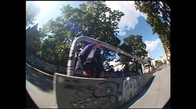 a man riding a skateboard up the side of a ramp